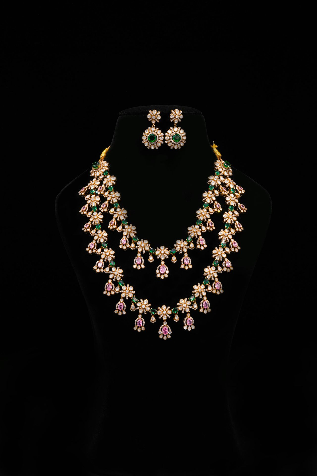 Elegant jewelry set displayed on a black mannequin.